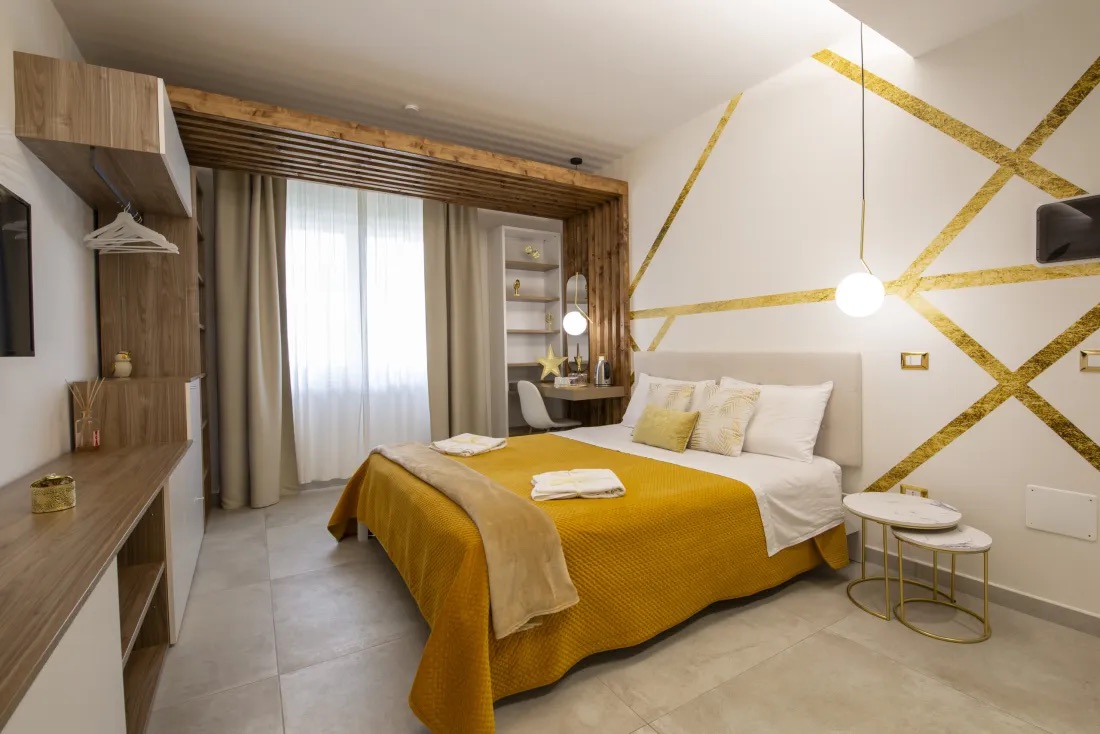 Golden Sahara room with double bed and gold details